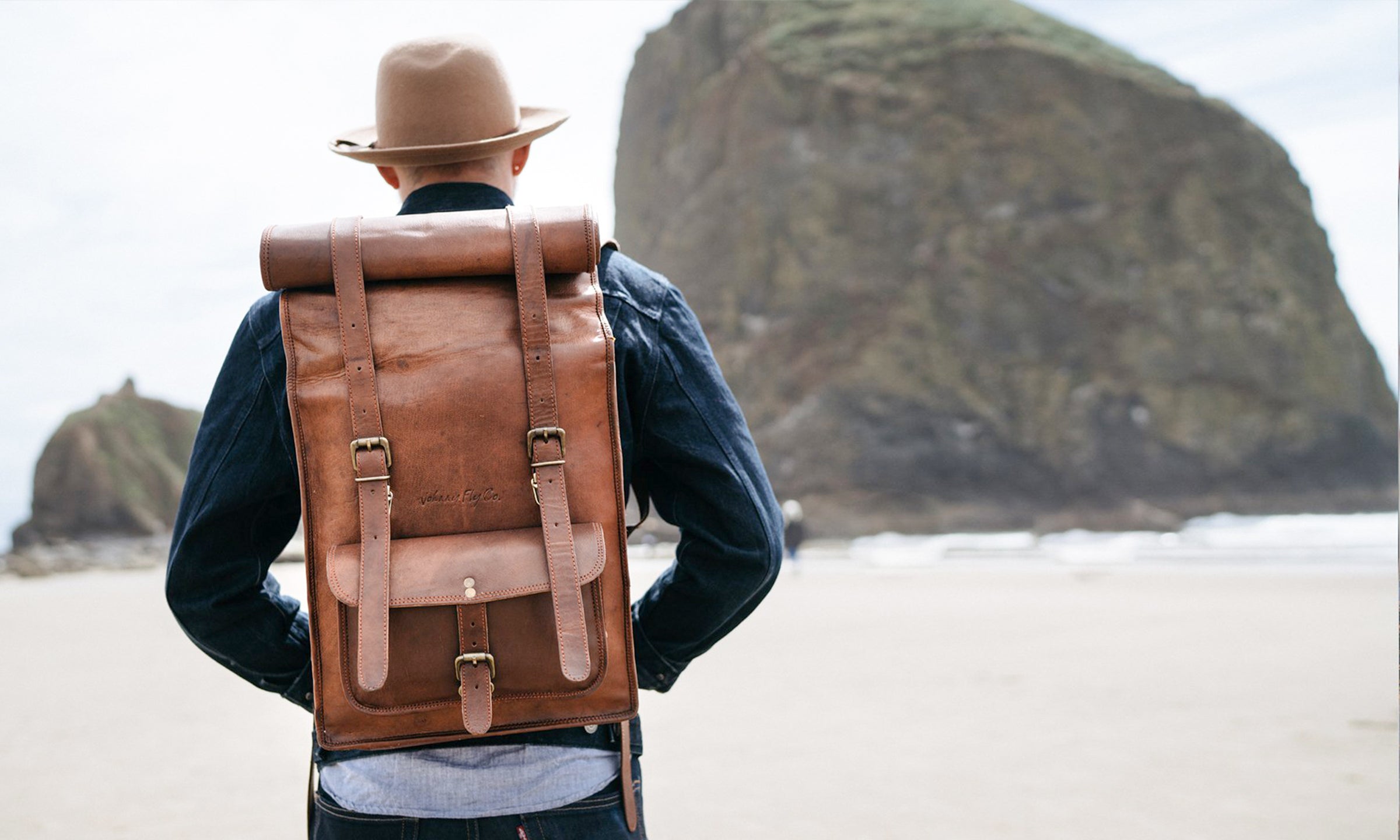 Leather roll top clearance backpack